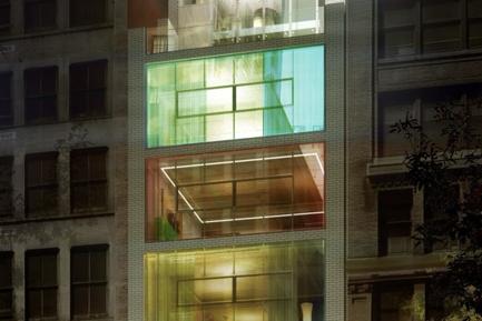 Glass building facade with green lighting